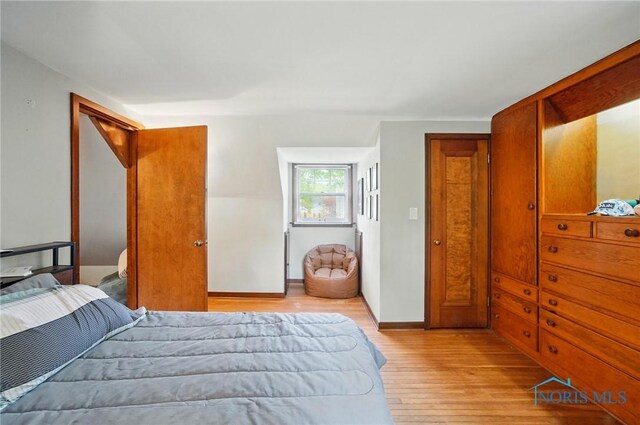 314 E 2nd St, Perrysburg, OH 43551 - bedroom with light wood-type flooring and baseboards