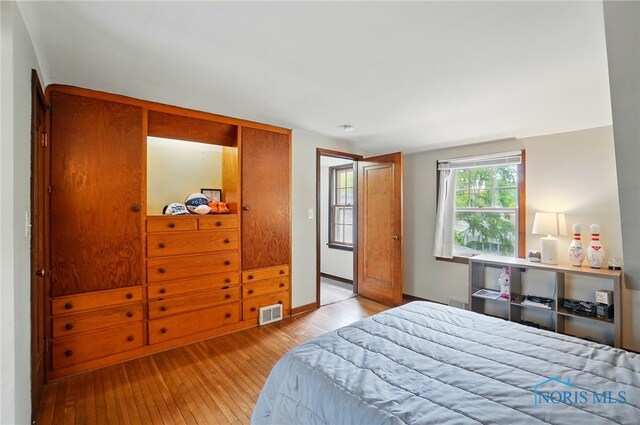 314 E 2nd St, Perrysburg, OH 43551 - bedroom with hardwood / wood-style flooring and baseboards