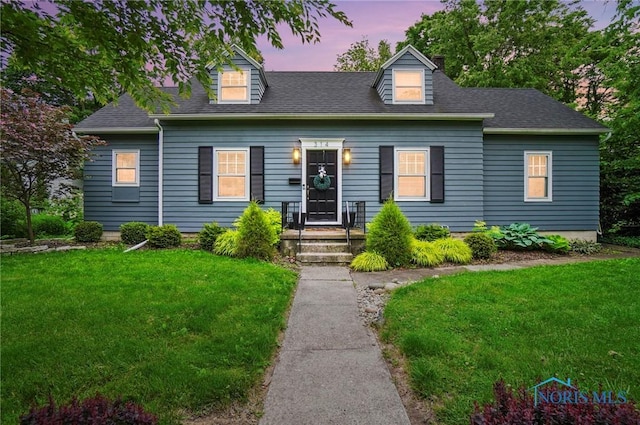314 E 2nd St, Perrysburg, OH 43551 - new england style home featuring a lawn and roof with shingles