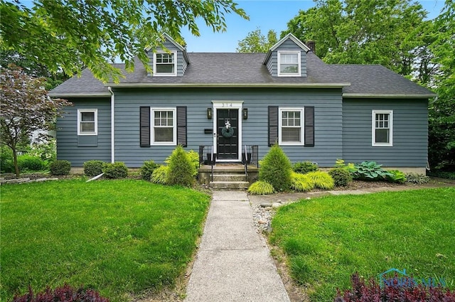 314 E 2nd St, Perrysburg, OH 43551 - new england style home with a front yard and a shingled roof