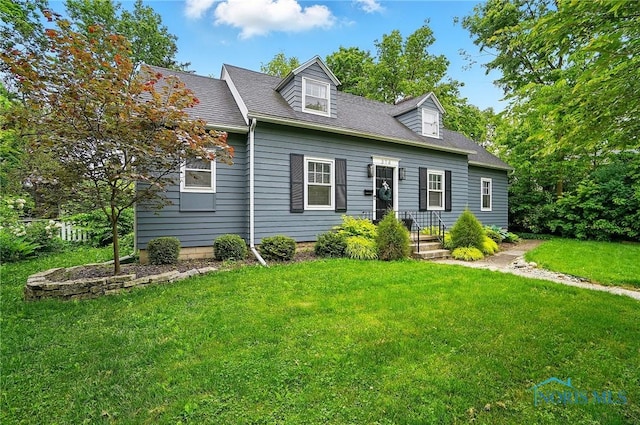 314 E 2nd St, Perrysburg, OH 43551 - cape cod house featuring a front lawn and roof with shingles