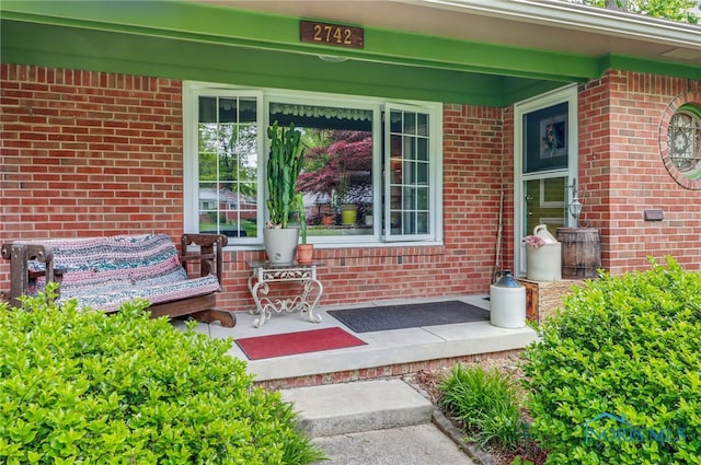 2742 Sandalwood Ave, Toledo, OH 43614 - view of exterior entry featuring a porch and brick siding