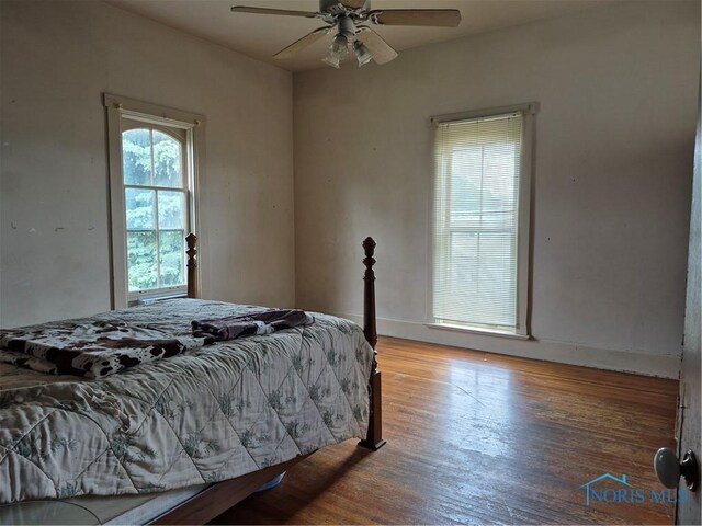 706 W Main Cross St, Findlay, OH 45840 - bedroom featuring wood finished floors, baseboards, and a ceiling fan