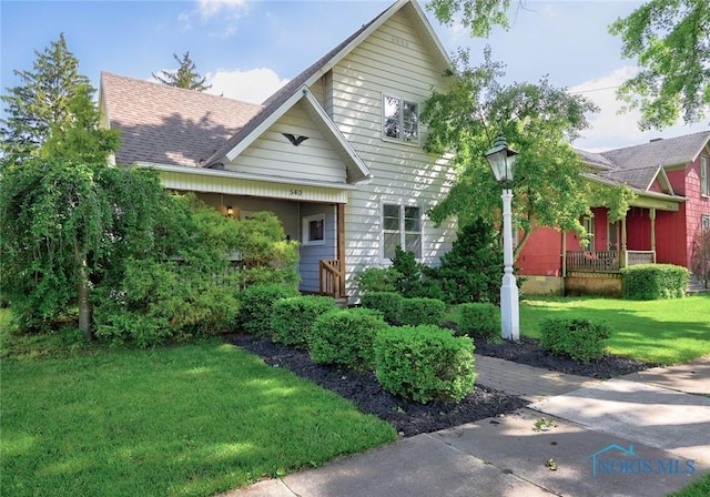 540 Center St, Findlay, OH 45840 - view of front facade featuring a front lawn and covered porch