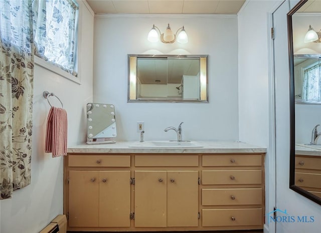540 Center St, Findlay, OH 45840 - full bath featuring vanity, a baseboard radiator, and crown molding