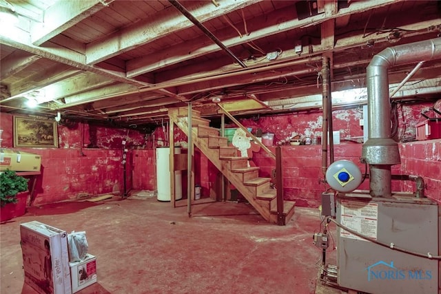 540 Center St, Findlay, OH 45840 - unfinished below grade area featuring water heater and stairs