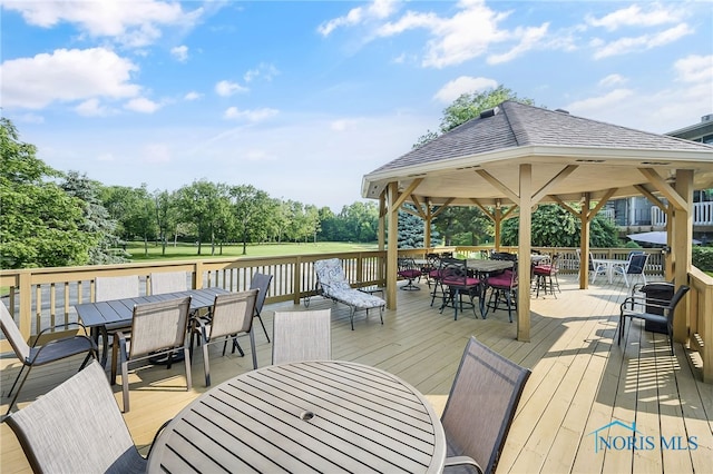 6640 Salisbury Rd Unit 212, Maumee, OH 43537 - wooden terrace with outdoor dining space, a gazebo, and view of scattered trees