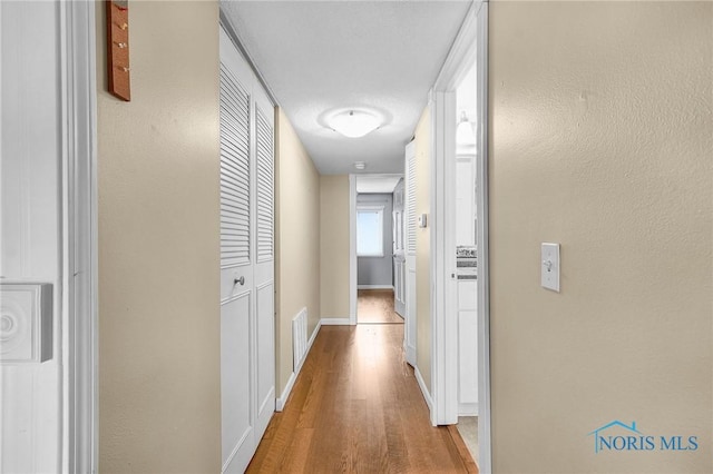 6640 Salisbury Rd Unit 212, Maumee, OH 43537 - hallway with wood finished floors and baseboards