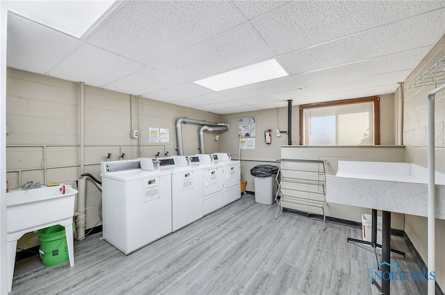 6640 Salisbury Rd Unit 212, Maumee, OH 43537 - community laundry room featuring washer and clothes dryer and light wood finished floors