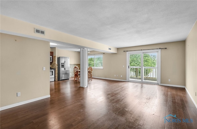 6640 Salisbury Rd Unit 212, Maumee, OH 43537 - unfurnished living room with a textured ceiling and dark wood-style flooring