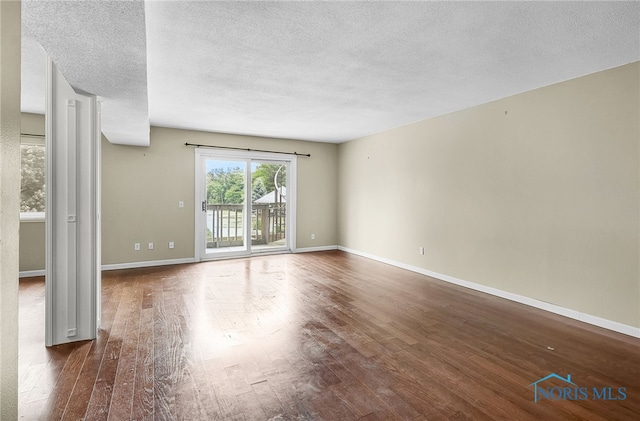 6640 Salisbury Rd Unit 212, Maumee, OH 43537 - spare room with wood-type flooring and a textured ceiling