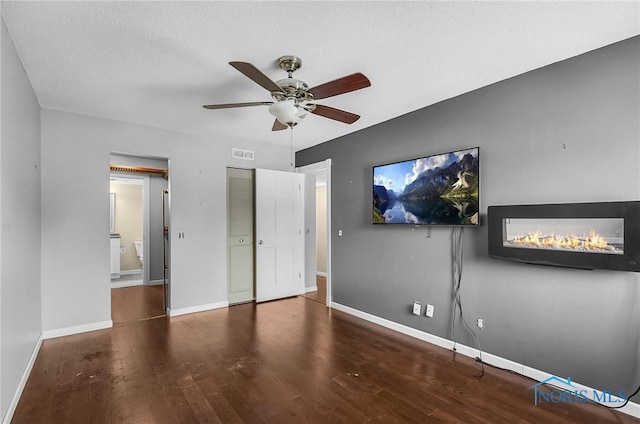 6640 Salisbury Rd Unit 212, Maumee, OH 43537 - unfurnished bedroom with wood finished floors, a ceiling fan, a closet, and a textured ceiling
