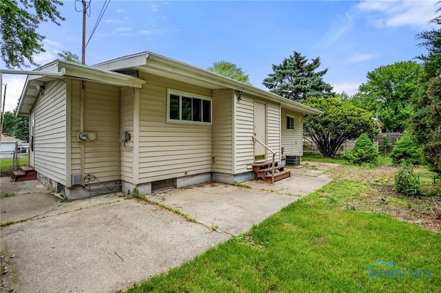 1765 Newport Ave, Toledo, OH 43613 - back of property with entry steps, a patio area, and central air condition unit