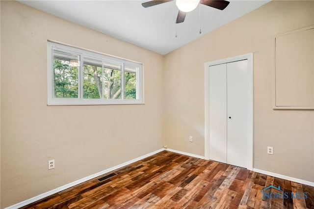 1765 Newport Ave, Toledo, OH 43613 - unfurnished bedroom with wood finished floors, baseboards, a closet, and a ceiling fan