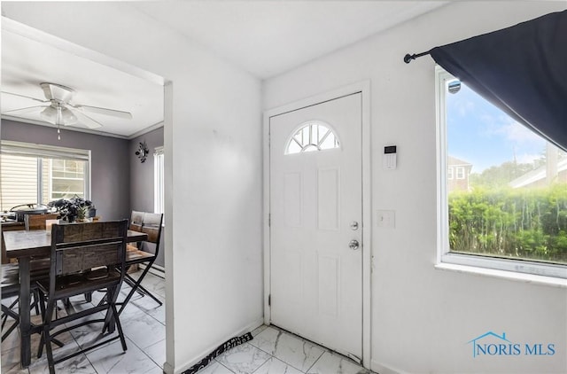 2146 Alvin St, Toledo, OH 43607 - entryway with light marble finish flooring, plenty of natural light, ceiling fan, and baseboards