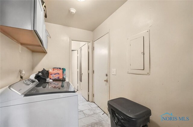 2146 Alvin St, Toledo, OH 43607 - laundry area featuring independent washer and dryer, electric panel, light marble finish flooring, and cabinet space