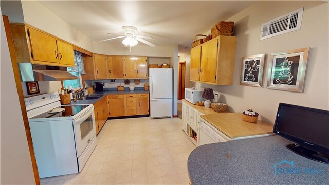 1501 Tiffin Rd, Fremont, OH 43420 - kitchen featuring white appliances, under cabinet range hood, ceiling fan, a sink, and brown cabinetry