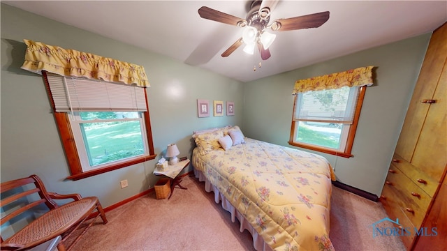 1501 Tiffin Rd, Fremont, OH 43420 - carpeted bedroom featuring baseboards and ceiling fan