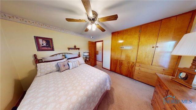 1501 Tiffin Rd, Fremont, OH 43420 - bedroom with light carpet and a ceiling fan