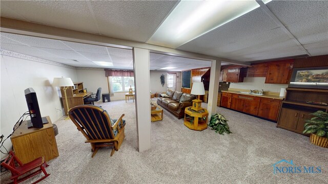 1501 Tiffin Rd, Fremont, OH 43420 - living room with light carpet and a paneled ceiling