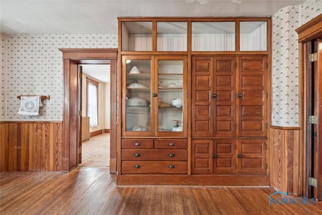 206 W Main St, Fayette, OH 43521 - foyer entrance featuring wallpapered walls, hardwood / wood-style floors, wainscoting, and wood walls