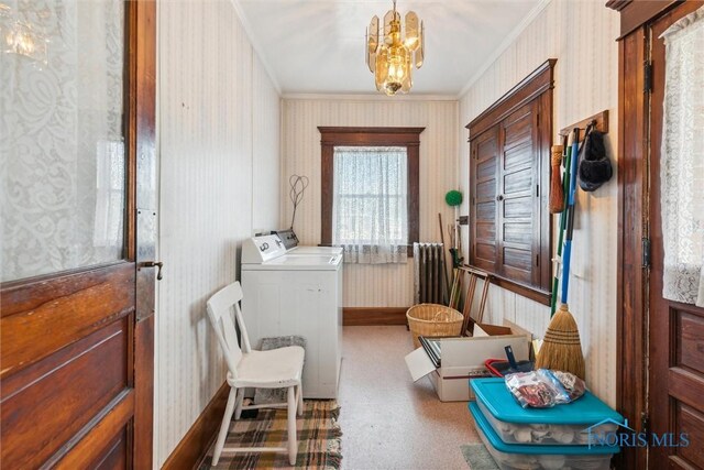 206 W Main St, Fayette, OH 43521 - laundry room with wallpapered walls, washer and dryer, ornamental molding, a chandelier, and baseboards