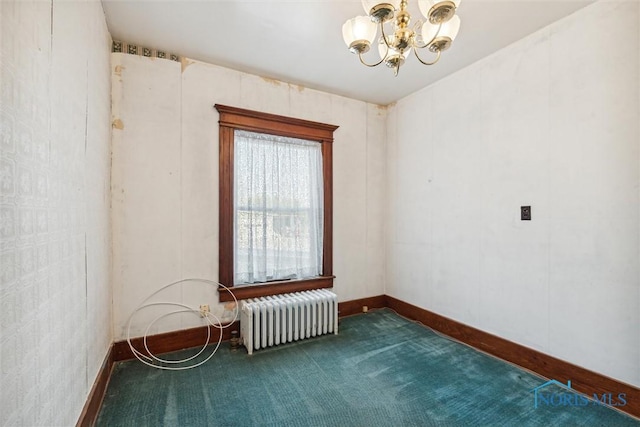 206 W Main St, Fayette, OH 43521 - empty room featuring radiator heating unit, dark colored carpet, a chandelier, and baseboards