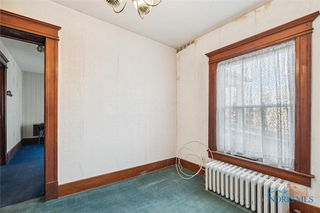 206 W Main St, Fayette, OH 43521 - carpeted spare room featuring radiator heating unit, a chandelier, and baseboards