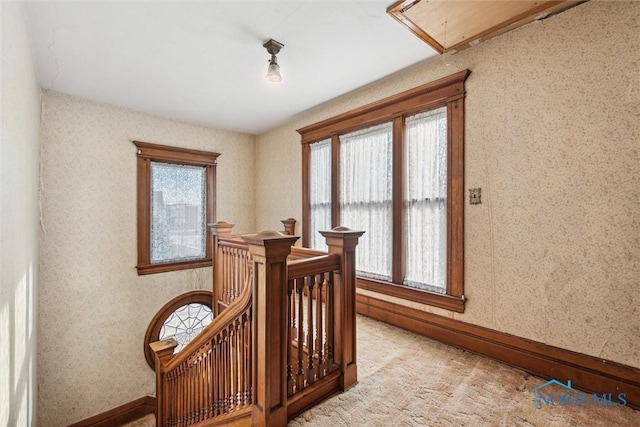 206 W Main St, Fayette, OH 43521 - stairway featuring attic access, baseboards, and wallpapered walls