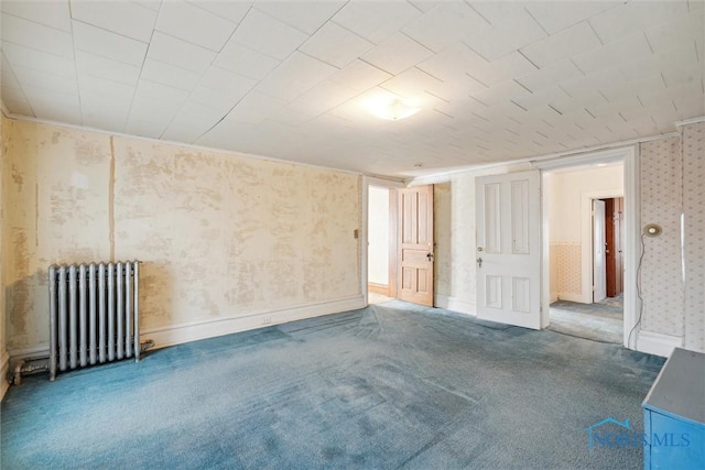 206 W Main St, Fayette, OH 43521 - carpeted spare room featuring radiator, wallpapered walls, and baseboards
