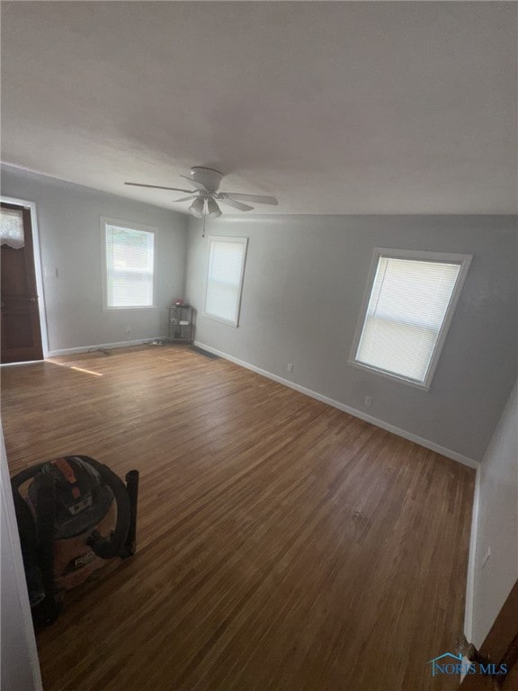642 Brookley Blvd, Toledo, OH 43607 - unfurnished living room with wood finished floors, baseboards, and a ceiling fan