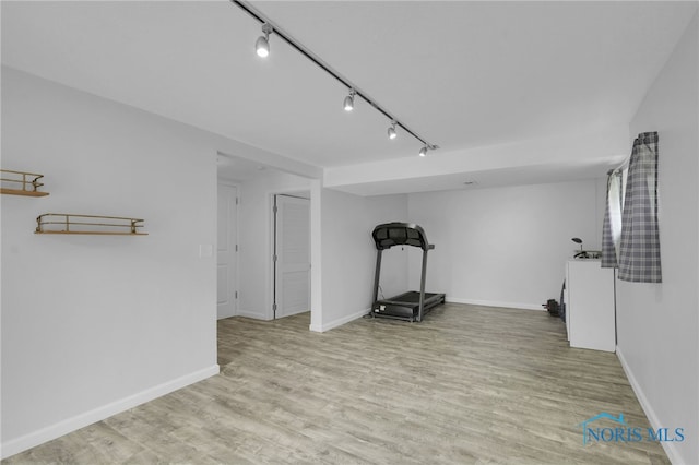 4238 Knollcrest Rd, Toledo, OH 43611 - workout area with rail lighting, baseboards, and wood finished floors