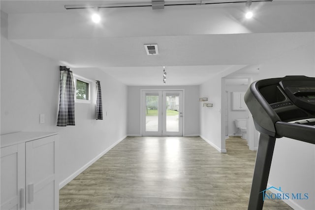 4238 Knollcrest Rd, Toledo, OH 43611 - entrance foyer featuring rail lighting, light wood finished floors, and baseboards
