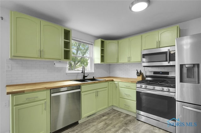 4238 Knollcrest Rd, Toledo, OH 43611 - kitchen with stainless steel appliances, wood counters, and green cabinets