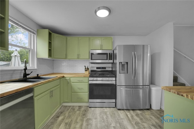 4238 Knollcrest Rd, Toledo, OH 43611 - kitchen with stainless steel appliances, green cabinets, and wood counters