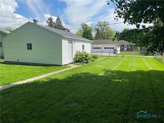 210 W William St, Maumee, OH 43537 - view of yard with a garage