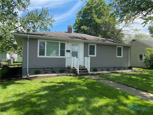 210 W William St, Maumee, OH 43537 - view of front of house featuring a chimney and a front lawn