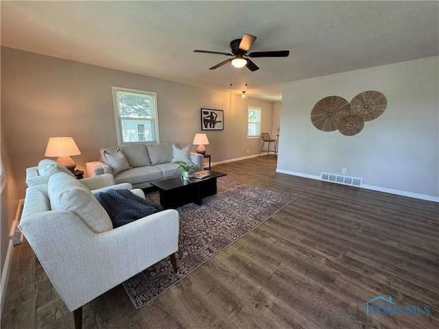 210 W William St, Maumee, OH 43537 - living area featuring baseboards, wood finished floors, and ceiling fan