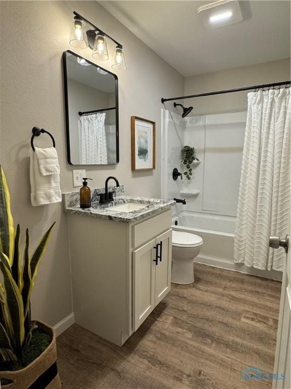 210 W William St, Maumee, OH 43537 - bathroom featuring vanity, toilet, wood finished floors, and shower / bath combo with shower curtain