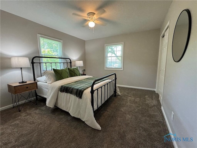 210 W William St, Maumee, OH 43537 - carpeted bedroom featuring baseboards and ceiling fan