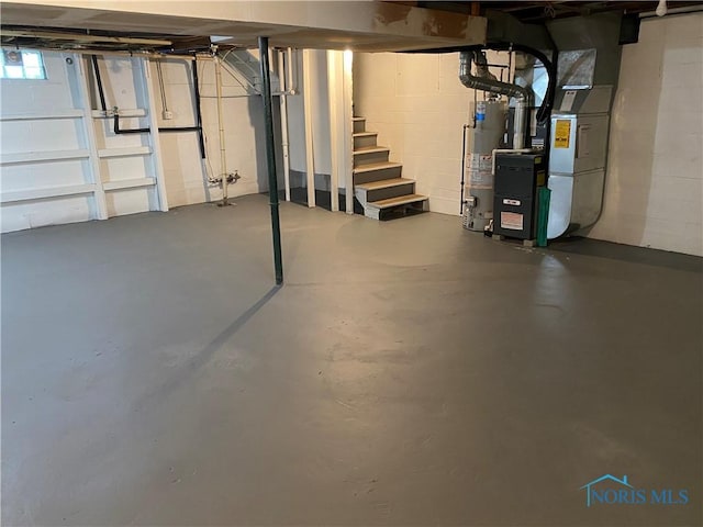 210 W William St, Maumee, OH 43537 - basement with stairs, water heater, heating unit, and concrete block wall