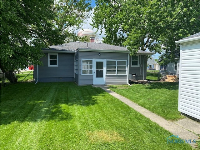 210 W William St, Maumee, OH 43537 - back of property with cooling unit and a shingled roof