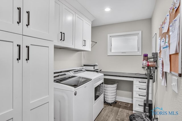 2714 W Rockridge Cir, Toledo, OH 43606 - laundry room with cabinet space, independent washer and dryer, wood finished floors, baseboards, and recessed lighting