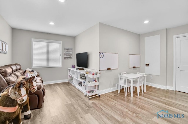 2714 W Rockridge Cir, Toledo, OH 43606 - living area with light wood-style floors, baseboards, and recessed lighting