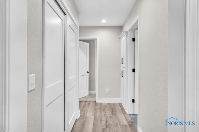 2714 W Rockridge Cir, Toledo, OH 43606 - hallway featuring wood finished floors, baseboards, and recessed lighting