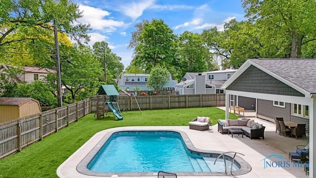 2714 W Rockridge Cir, Toledo, OH 43606 - view of swimming pool with an outdoor living space, a patio, and a playground
