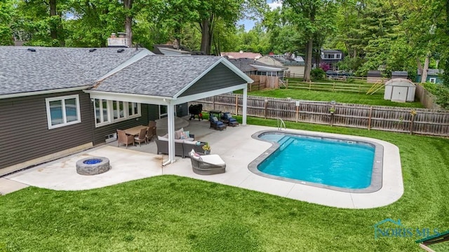 2714 W Rockridge Cir, Toledo, OH 43606 - view of swimming pool featuring a patio and an outdoor living space with a fire pit