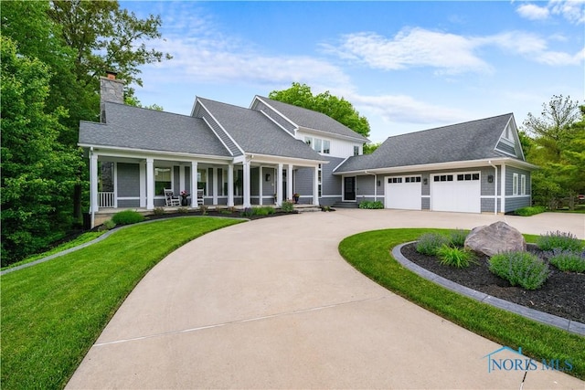 1860 Watermill Ln, Perrysburg, OH 43551 - view of front facade with curved driveway, a chimney, a front yard, and a porch