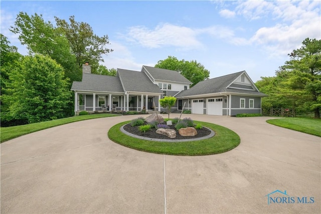 1860 Watermill Ln, Perrysburg, OH 43551 - view of front facade with curved driveway, a chimney, a front lawn, and an attached garage
