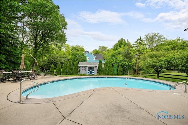 1860 Watermill Ln, Perrysburg, OH 43551 - swimming pool featuring a patio area and view of scattered trees